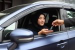 Muslim woman new receive car keys